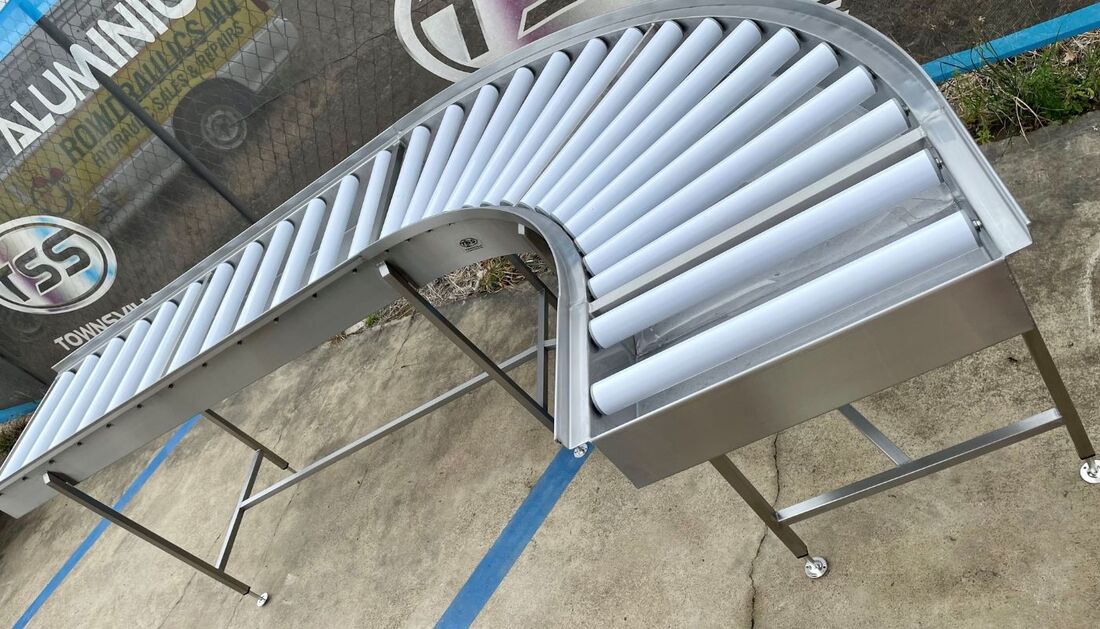 Stainless steel commercial dishwasher roller bench in workshopImage_30621876.default